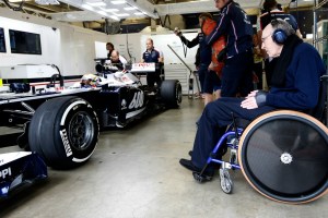 Pastor Maldonado in the Williams pit garage with Sir Frank Williams looking on (Glenn Dunbar/Williams F1)